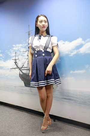 Tangshan City - December 19, 2015: A female models show skirt in the interior, Tangshan City, Hebei, China, December 19, 2015のeditorial素材