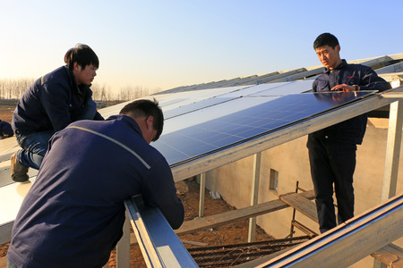 Luannan - December 11, 2015: Engineering and technical personnel to install solar photovoltaic...