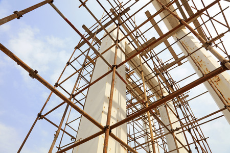 Oxidation rusty scaffolding and unfinished buildings low angle view