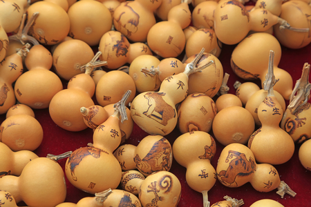 Carved gourd pilling togetherのeditorial素材