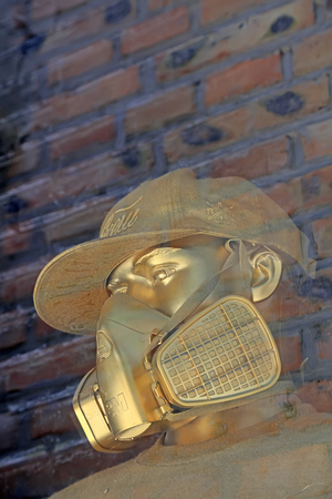 Beijing - May 8, 2016: a feature of the golden mask figure sculpture, 798 art area, Beijing, Chinaのeditorial素材