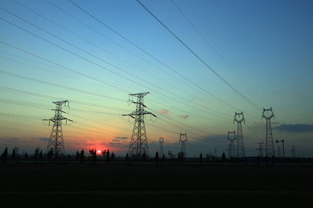 electric tower in the setting sunの写真素材