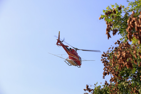 Luannan County - September 3, 2018: Agricultural helicopters flying in the air, Luannan County, Hebei Province, Chinaのeditorial素材