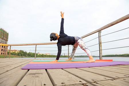 Woman practicing yoga in the parkのeditorial素材