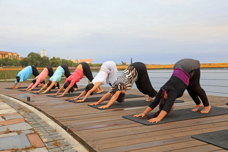 Luannan County - September 18, 2016: yoga exercise women in the park, Luannan County, Hebei Province, China.のeditorial素材