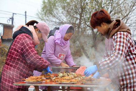 Luannan County - November 11, 2016: cook dishes, in Chinese style wedding ceremony, Luannan County, Hebei Province, Chinaのeditorial素材