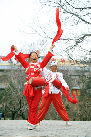 Yan'an City - April 3, 2018: Ansai waist drum performance outdoors, Yan'an City, Shaanxi Province, Chinaのeditorial素材