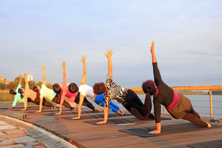 Luannan County - September 18, 2016: yoga exercise women in the park, Luannan County, Hebei Province, China.のeditorial素材