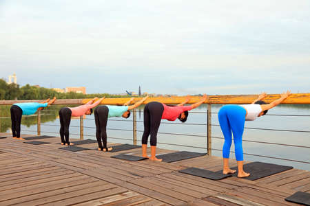 Luannan County-September 18, 2016: yoga exercise women in the park, Luannan County, Hebei Province, China.のeditorial素材