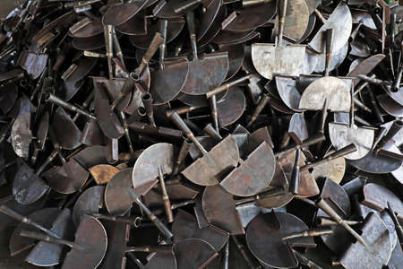 Semi-finished hardware tools are piled up in the production workshop
