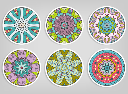 Decorative round ornaments set, isolated elements. Colorful mandala, stylized flower. Abstract geometric doodle patterns for plate decoration, fabric print, business or greeting card designのイラスト素材