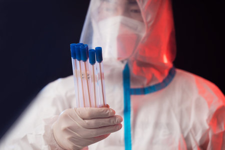 Medical staff in protective suits doing nucleic acid testing
