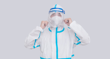 Doctor wearing protective suit doing medical experiment in laboratory, nucleic acidの写真素材