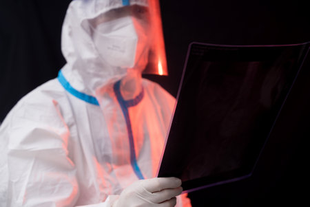 Doctor wearing protective suit doing medical experiment in laboratory, nucleic acidの写真素材