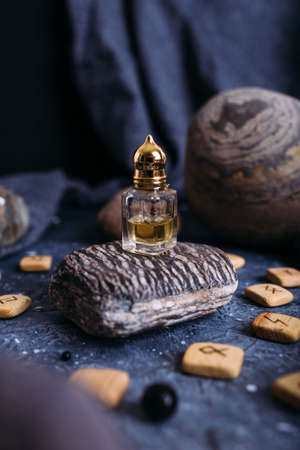 Small glass bottle with natural magic oil. Cosmetic and magic elixir.の写真素材