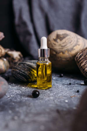 Small glass bottle with natural magic oil. Cosmetic and magic elixir.の写真素材