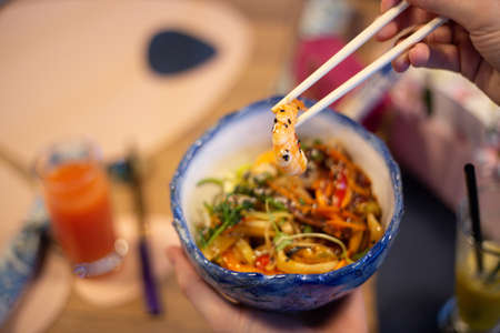Asian food bowl bowl with shrimp, vegetables and rice noodlesの写真素材