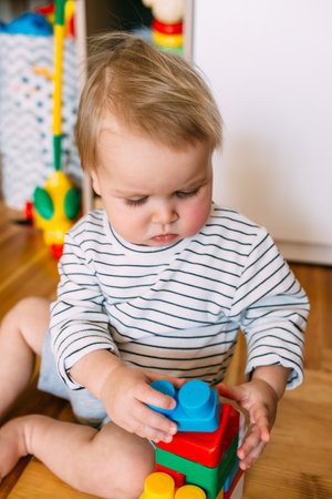 Cute little child is playing at home