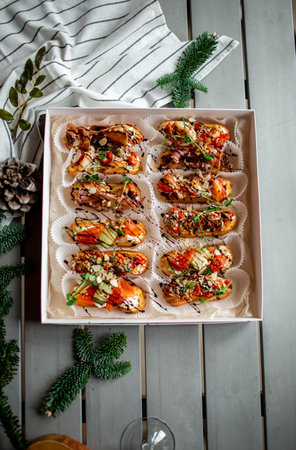 Eclairs with salmon, fresh vegetables and herbs, gourmet snacks.