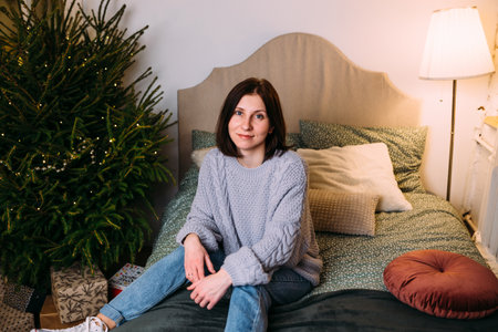 Beautiful young girl at home for christmas with gifts