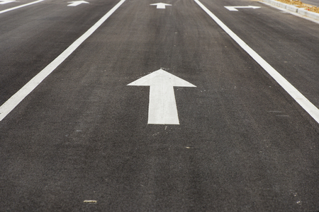 Asphalt road direction arrow