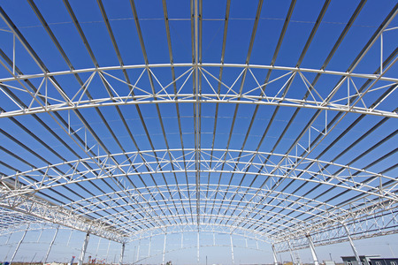 Steel frame structure, under the blue skyの写真素材
