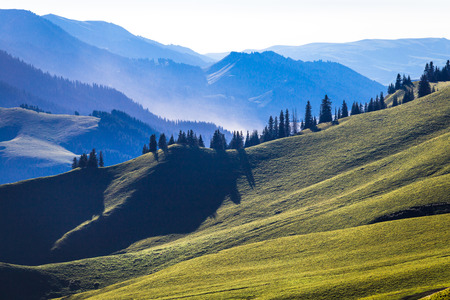 The sunset layers of mountains, vast background material.の写真素材