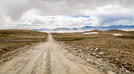 The gravel road leading to the distance.の写真素材