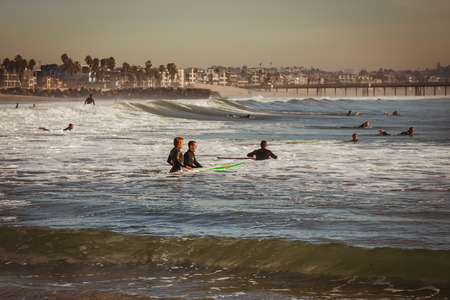 Surfers preparing to hit the wavesのeditorial素材