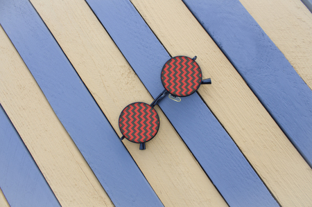 Creative sunglasses on a gray striped surface white stripes are not finished.の写真素材