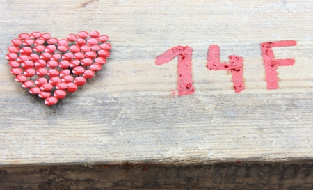 14 F Saint Valentine symbol on wooden backgroundの写真素材