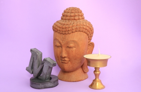 Om,candlestick and buddha