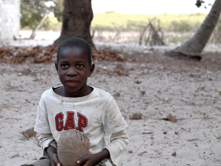 CARABANE,SENEGAL-APRIL 15, 2014  Pretty boy poses for the tourist in the street on April 15, in Carabane-Senegal のeditorial素材