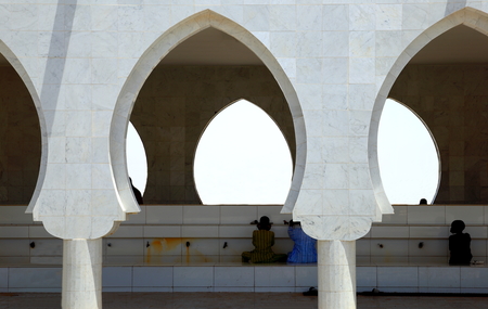 TOUBA,SENEGAL-APRIL 18, 2014  Men pray and wash in the mosque on April 18, in Touba-Senegal のeditorial素材