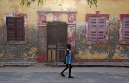 SAINT LOUIS DU SENEGAL,SENEGAL-APRIL 18, 2014  Children play quietly in the calm street on April 18, in Senegal のeditorial素材