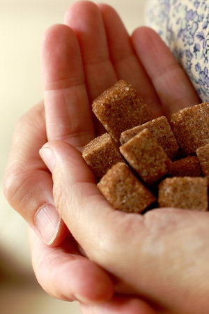 Brown sugar in handsの写真素材