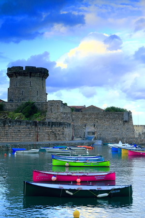 SOKOA, FRANCE-AUGUST 15, 2014: Local fishermen  tie up their boats to the pier on August 15, in...