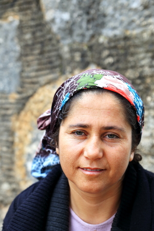 SIMENATURKEYAPRIL 02 2015: Local merchant watches the tourist sitting at the castle gateway on April 02 Turkey.のeditorial素材