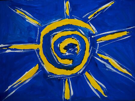 gouache painting of the bright yellow sun on a blue backgroundの写真素材