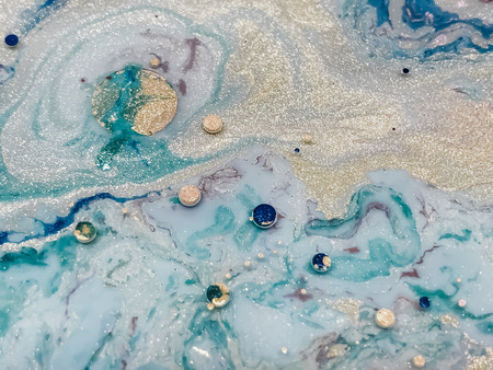 Abstract colorful bubbles marble background with milk oil and soap. Colored acrylic react to a drop...