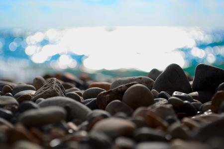 Pebble against the sea