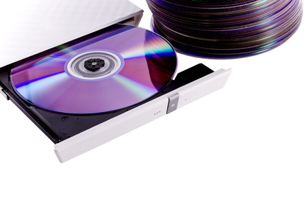 Horizontally oriented cd dvd burner with a disc inside and stack of a cd