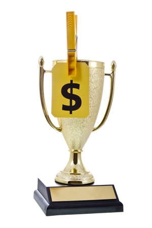Every victory has its price,money is the question Winner cup with a yellow label with dollar sign image and yellow clothespinの写真素材