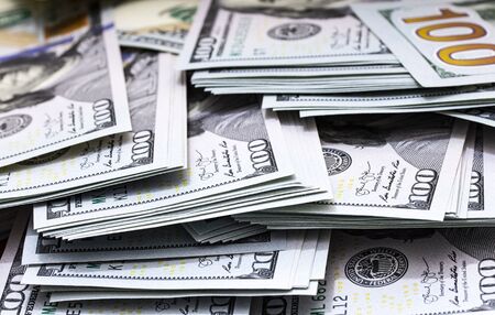 US dolllars bills money packs background. Face side. Macro close up.