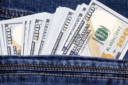 American dollar bills in jeans pocket background. Macro close-up.の写真素材