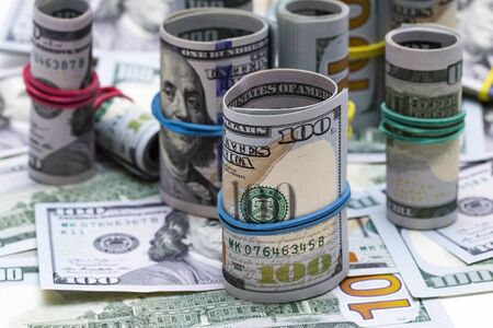 One hundred dollar bills bundles macro close up background.の写真素材