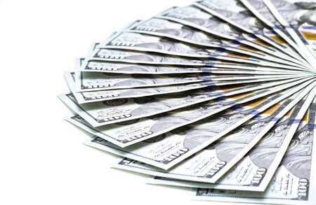 Fan of 100 US Dollars Banknotes isolated on white macro close up