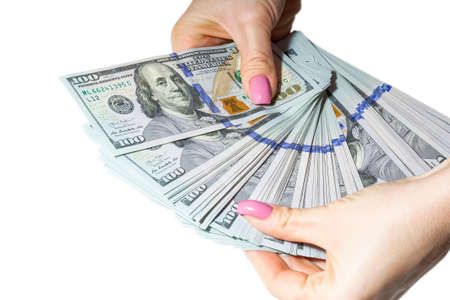 Woman hands holding money banknotes isolated on whiteのeditorial素材