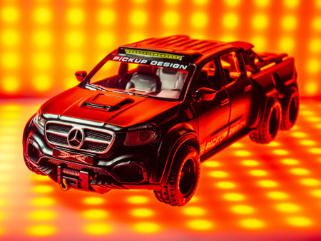 Odessa, Ukraine - May 10, 2021 - Collectible car toy Mercedes-Benz X Pick Up Truck on a red luminous...