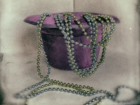 Hat, high inverted cylinder and decorative beads on a white background. Imitation of old pictures. Retro.の写真素材